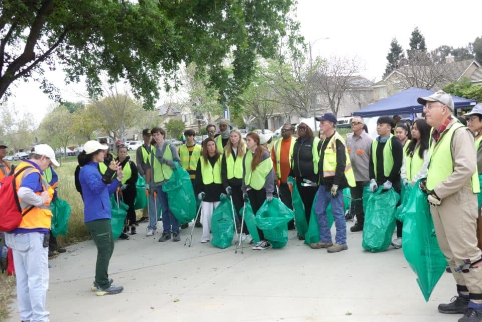 keep coyote creek beautiful director presenting about organization
