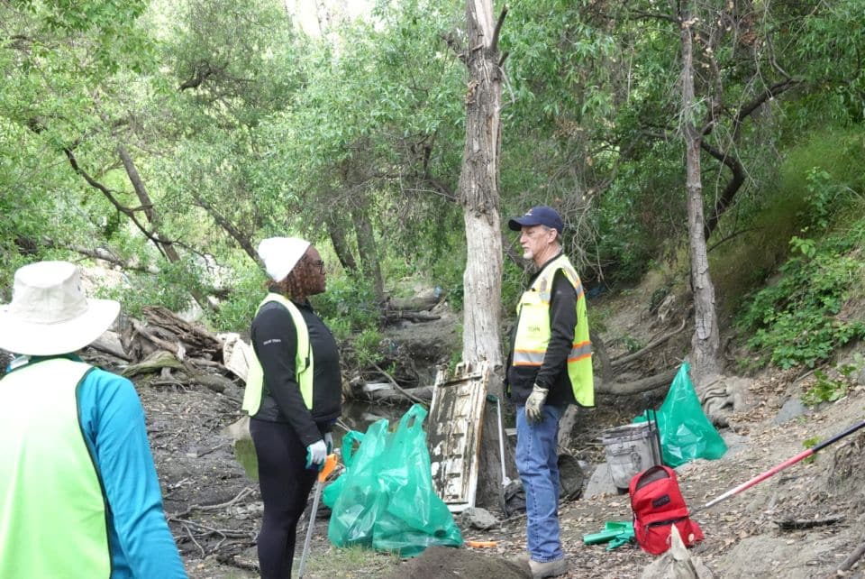 volunteers chatting near creek