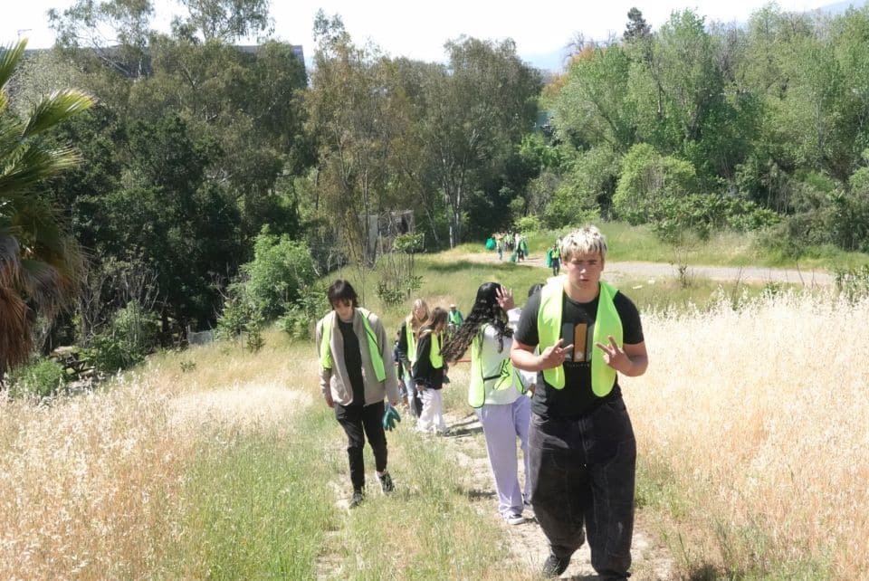 volunteers walking along future five wounds trail